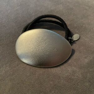 Colette Malouf Metal pony hold